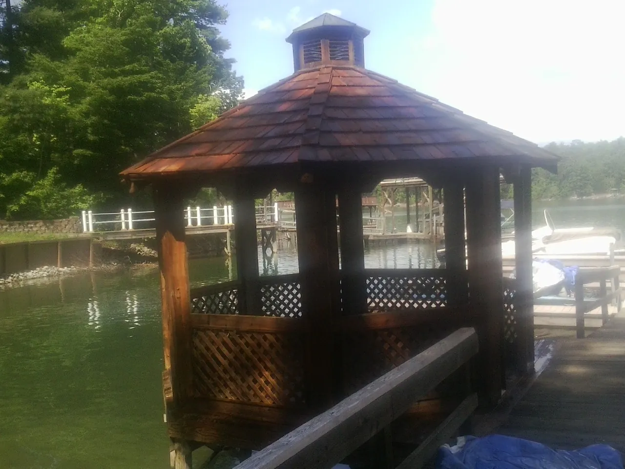 Cedar shake gazebo roof rebuilt on a lake dock in Mitchellville